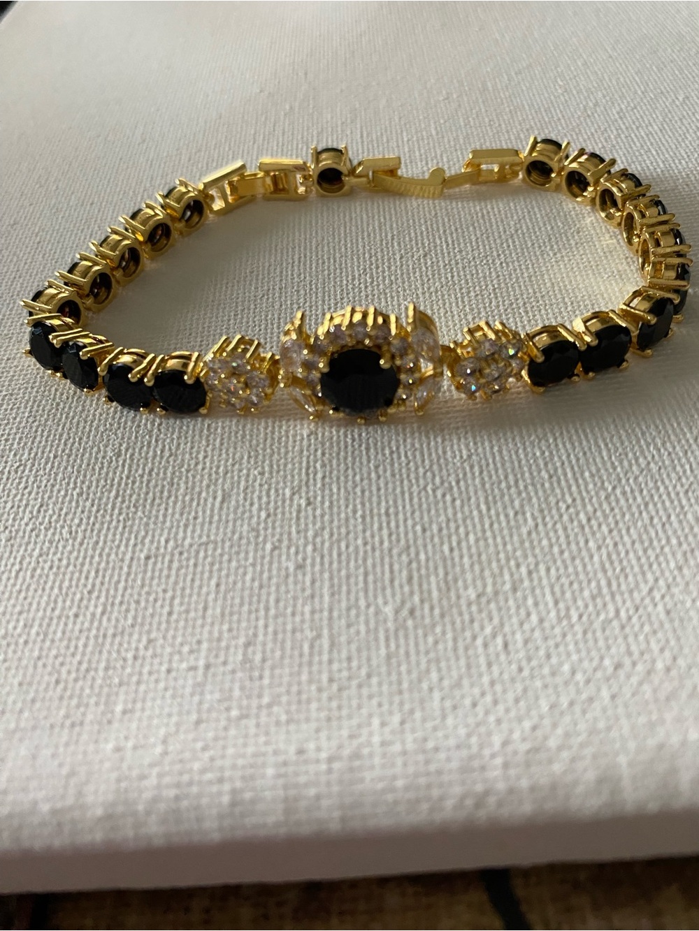 Gold-tone Tennis Bracelet with Black and Clear Gemstones
